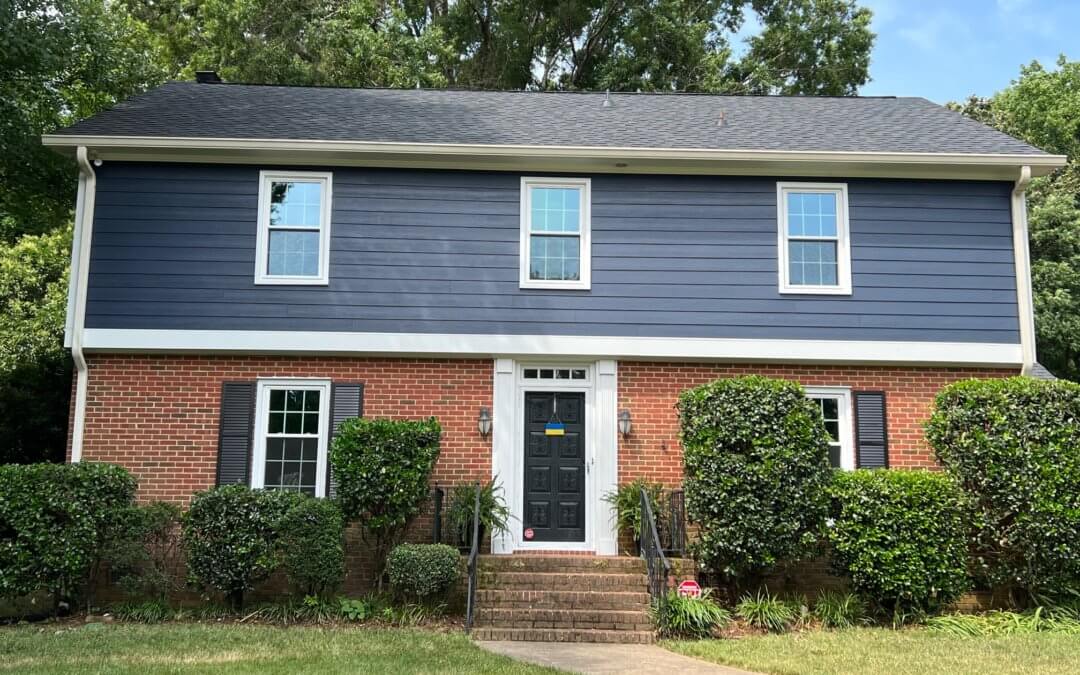 house with beautiful blue new siding