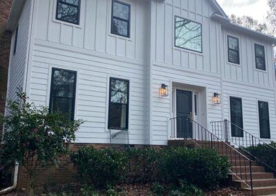 before image of the front of a house in Matthews, NC before getting new James Hardie siding, panels, and trim