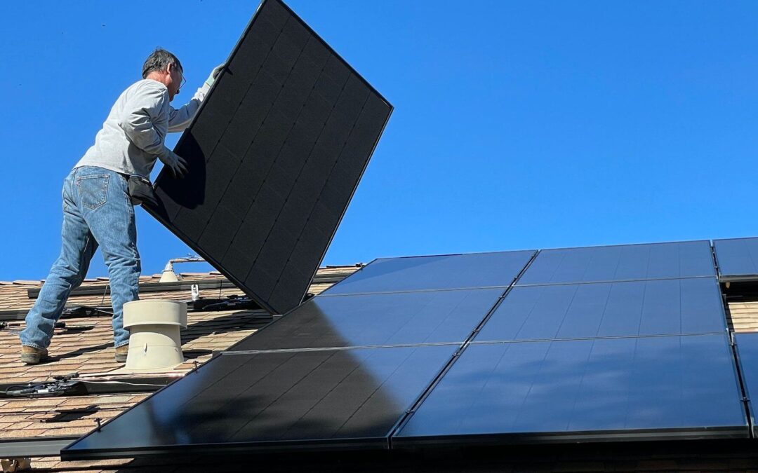 Crew-member from Southern Home Pros working on solar panel installation