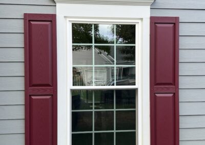 Raised panel vinyl shutters Color: Wineberry