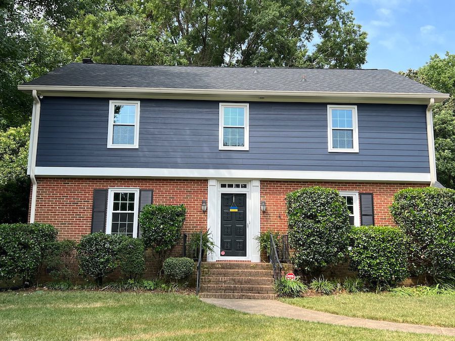 Home with siding and brick exterior 