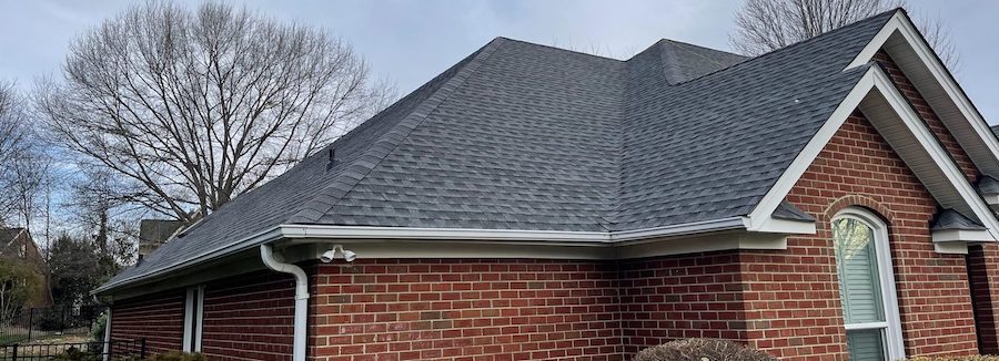 Architectural asphalt shingle roof installed on residential home exterior