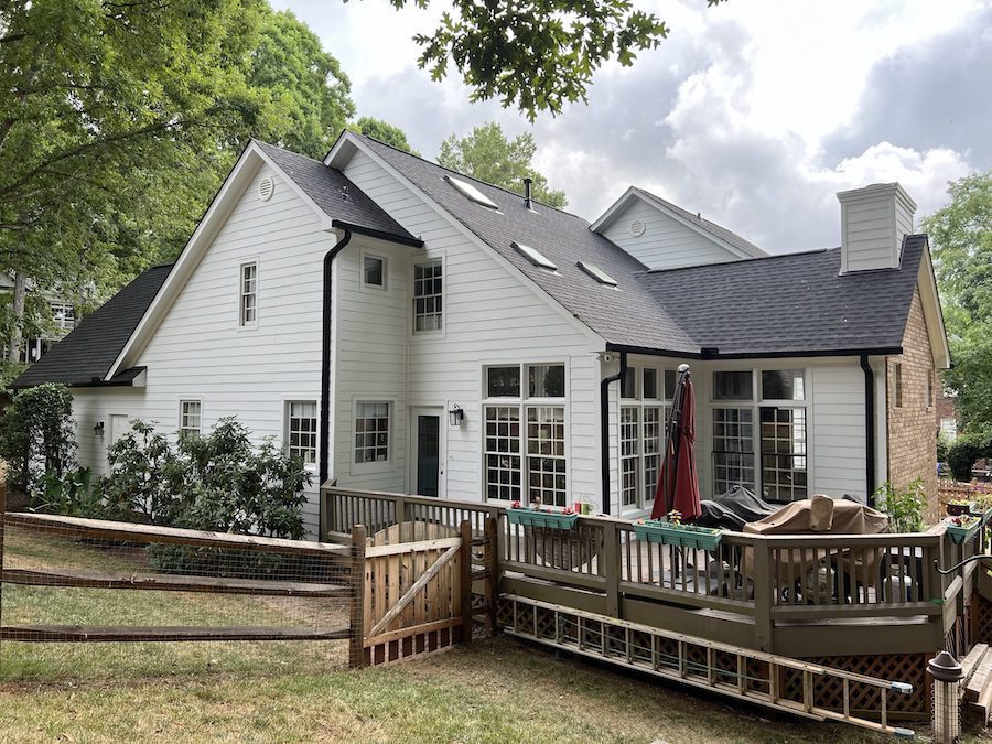 Energy-efficient GAF roofing shingles installed on modern residential home
