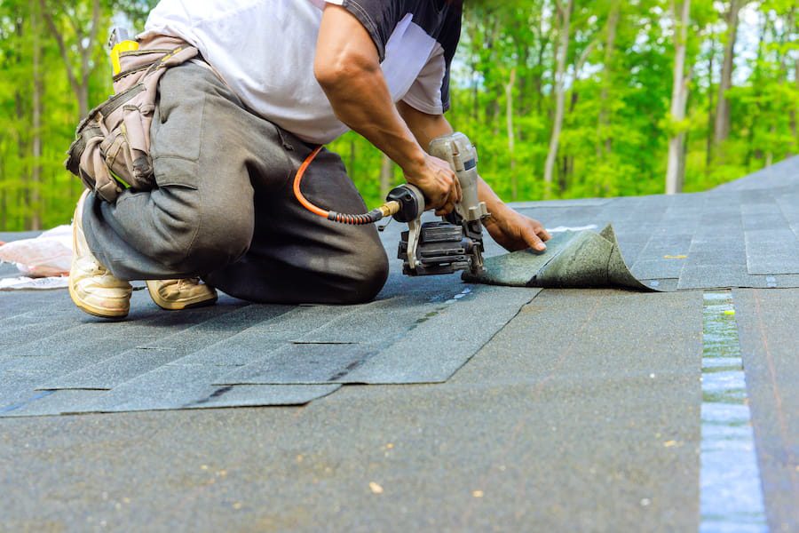 Roof replacement underway on a home in the Greater Charlotte area